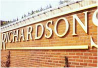Raised wooden gold leaf letters